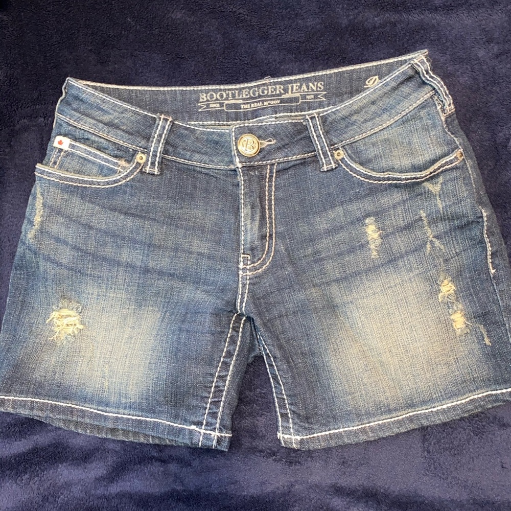 Bootlegger ripped denim shorts